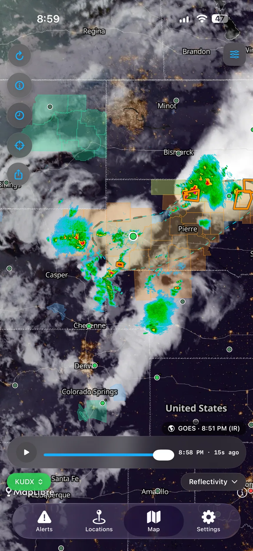 GOES satellite imagery layered over radar across the Plains at night.